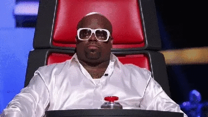 GIF showing a guy press a red button.