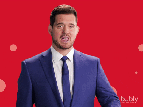 GIF showing a guy in a suit marking a check symbol in thin air.